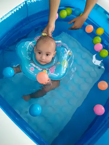 Joyful baby in water spa
